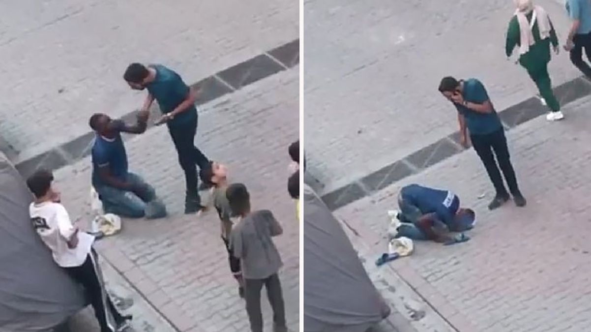 Çalışma izni bulunmayan Afrikalı genç, kendisini bırakması için sivil polisin ayaklarına kapandı